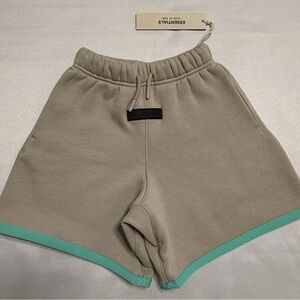 Essentials Kids Beige Shorts with Teal Trim. Size - 6/7